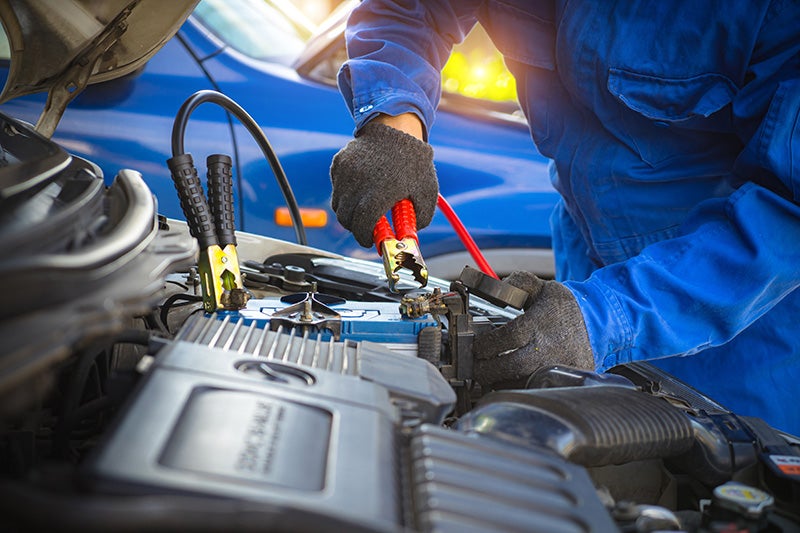 A technition installing a battery